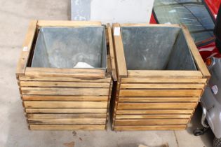 A PAIR OF WOODEN PLANTERS WITH GALVANISED LINERS