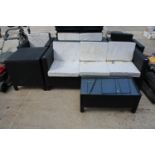 A SIX PIECE RATTAN GARDEN FURNITURE SET COMPRISING OF A THREE SEATER, A TWO SEATER, TWO CHAIRS, A