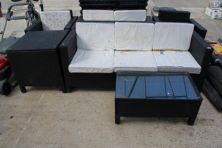 A SIX PIECE RATTAN GARDEN FURNITURE SET COMPRISING OF A THREE SEATER, A TWO SEATER, TWO CHAIRS, A