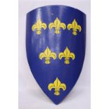 A LARGE VINTAGE HAND PAINTED WALL SHIELD, HEIGHT 106CM. THE SHIELD WITH BLUE BACKGROUND WITH SIX