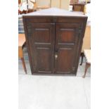 A GEORGE III OAK TWO DOOR PANELLED CORNER CUPBOARD, 36.5" WIDE