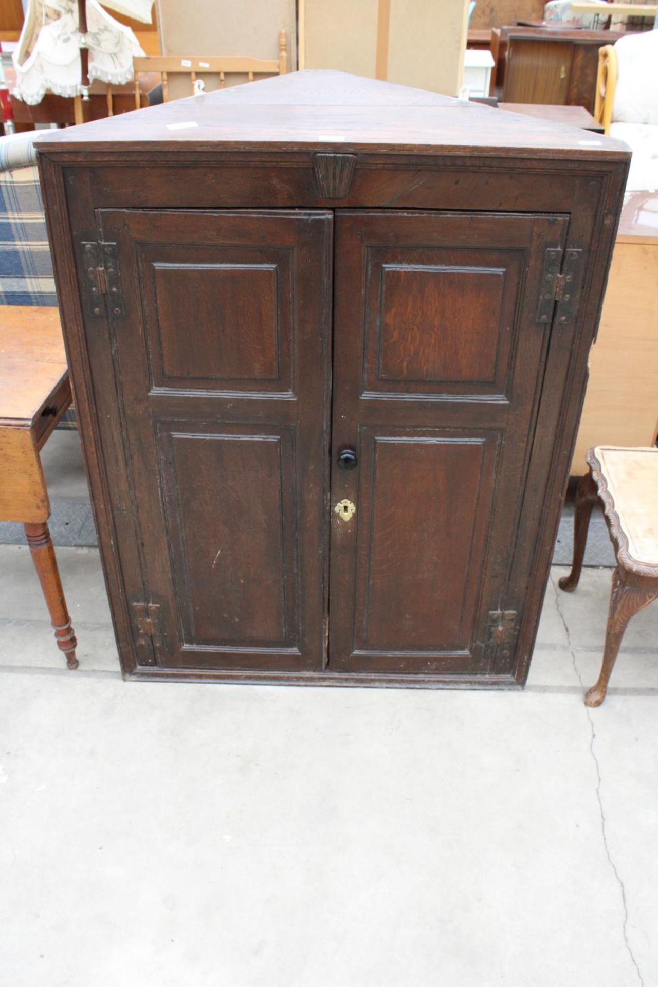 A GEORGE III OAK TWO DOOR PANELLED CORNER CUPBOARD, 36.5" WIDE