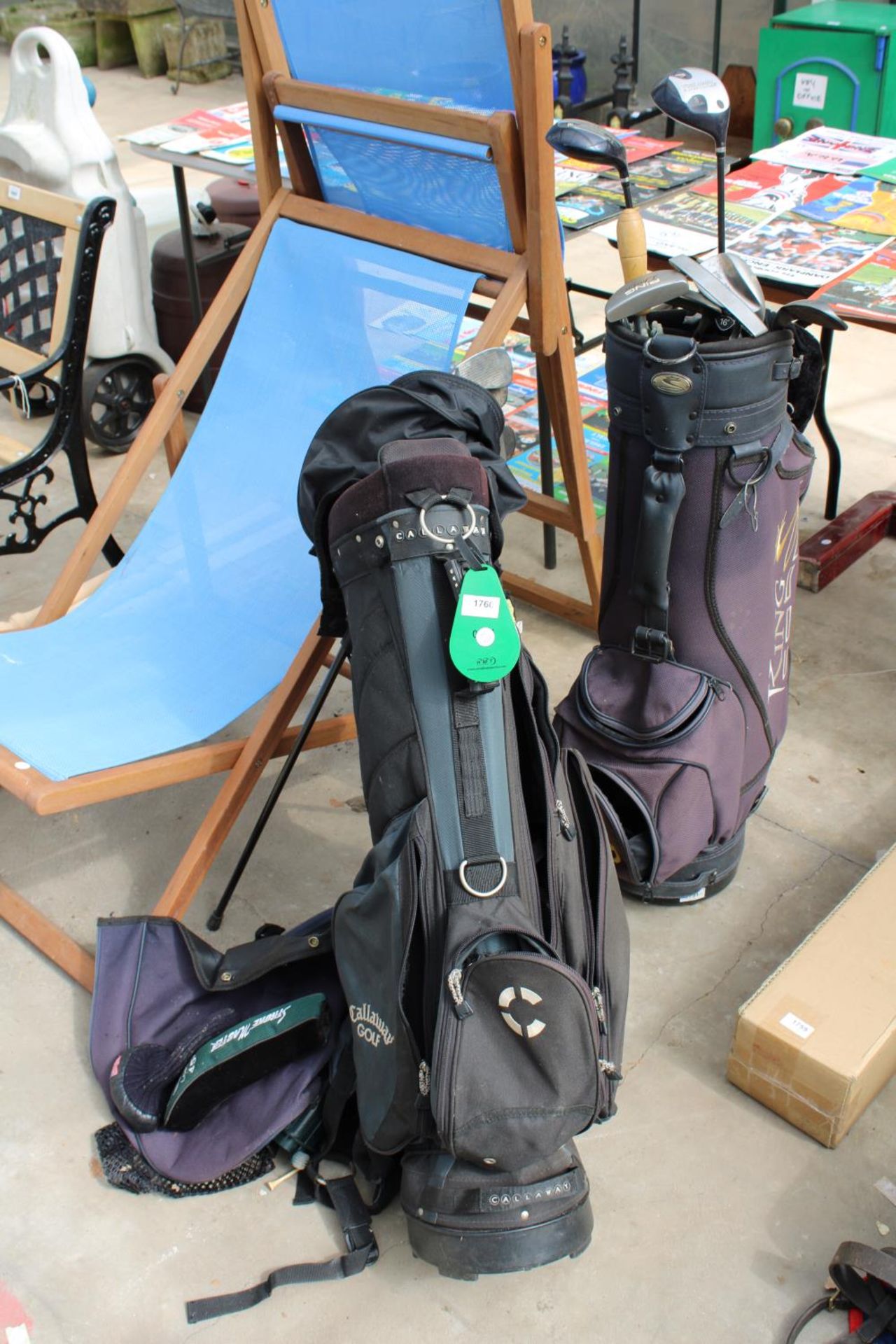 TWO GOLF BAGS AND AN ASSORTMENT OF GOLF CLUBS