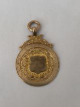 A HALLMARKED 9CT GOLD BIRMINGHAM SPORTING FOB INSCRIBED "DEVON WED LEAGUE CUP WINNERS 1925-26 S.