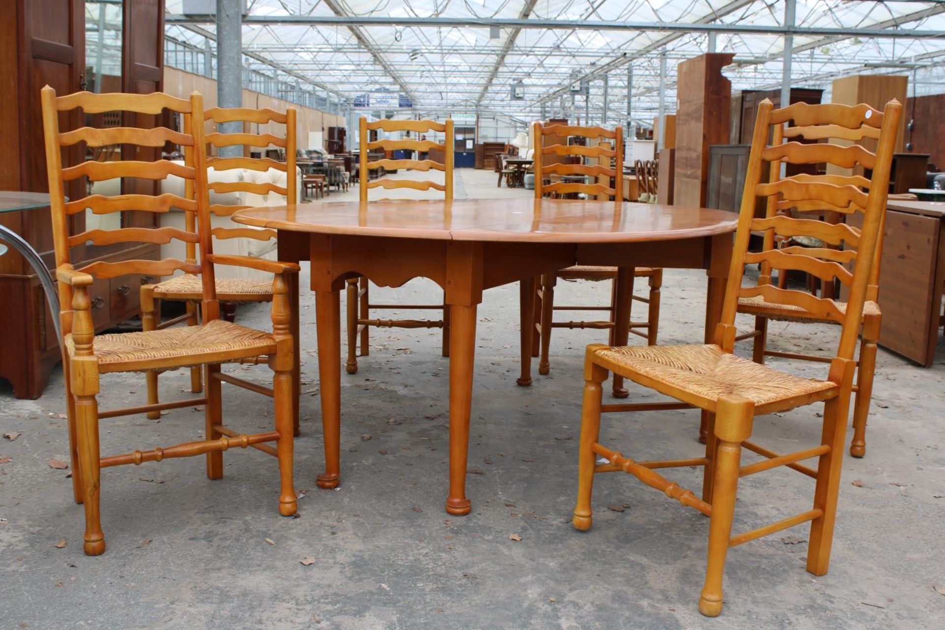 A GEORGIAN STYLE OVAL OAK WAKES TABLE, 77" X 59" OPENED AND SIX LADDER BACK DINING CHAIRS WITH - Image 4 of 9