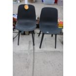 A PAIR OF MOULDED PLASTIC DINING CHAIRS