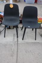 A PAIR OF MOULDED PLASTIC DINING CHAIRS