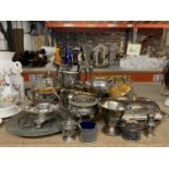 A LARGE QUANTITY OF SILVER PLATE TO INCLUDE JUGS, CANDLESTICKS, BOWLS, A TEAPOT, COFFEE POT,