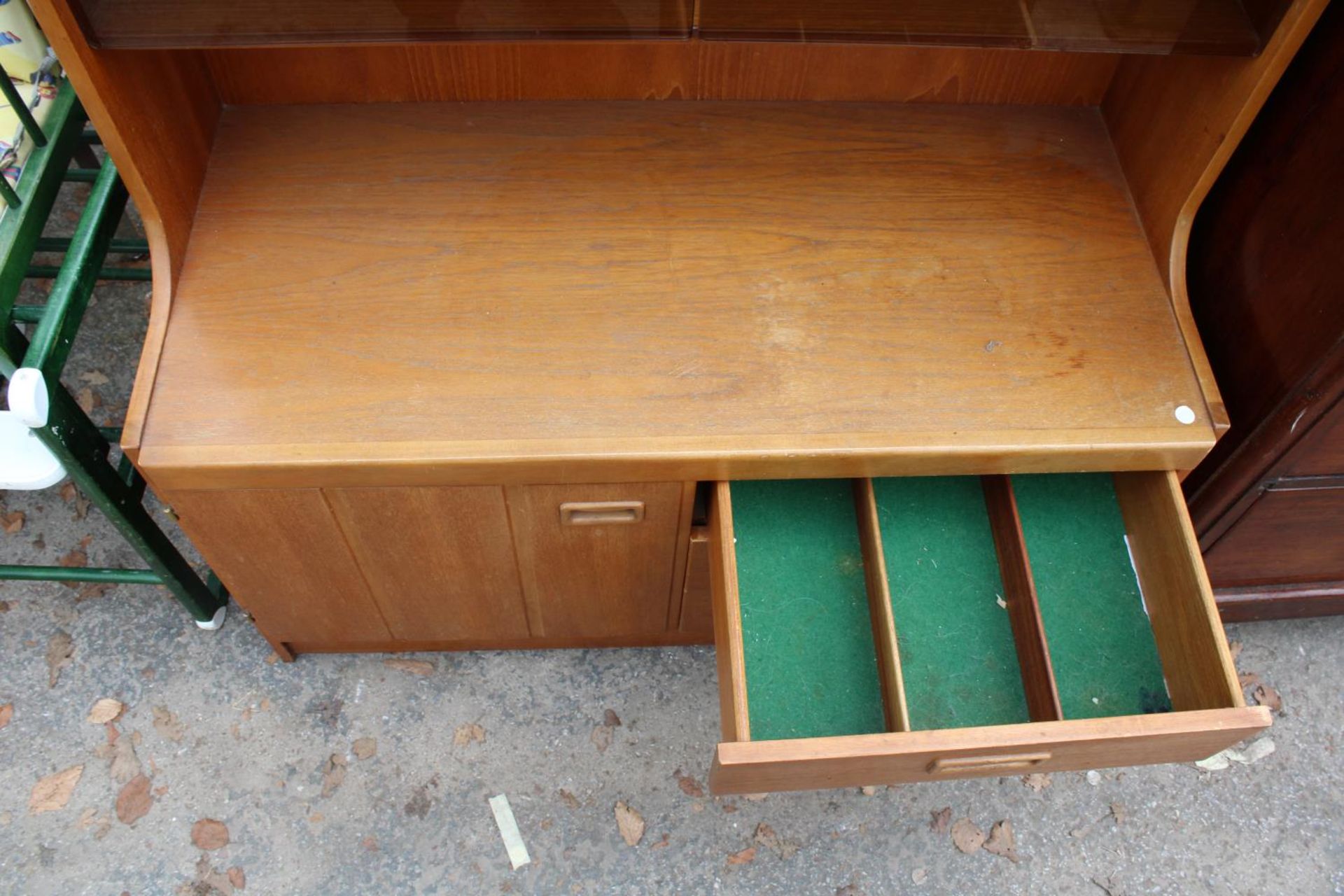 A RETRO TEAK UNIT WITH SMOKED GLASS DOORS, CUPBOARD AND DRAWERS TO BASE. 39.5" WIDE - Image 2 of 2