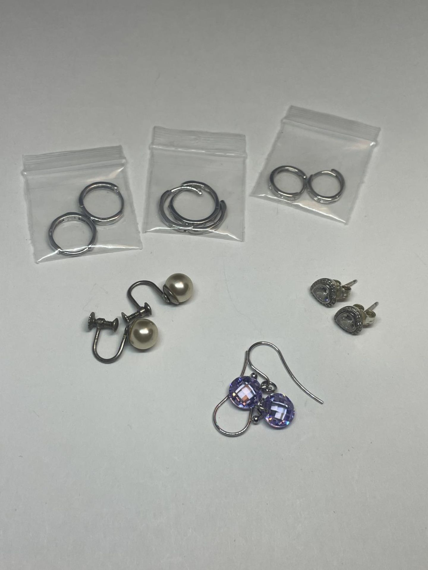 SIX PAIRS OF SILVER EARRINGS