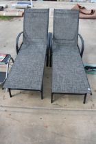 A PAIR OF METAL FRAMED GREY GARDEN LOUNGERS