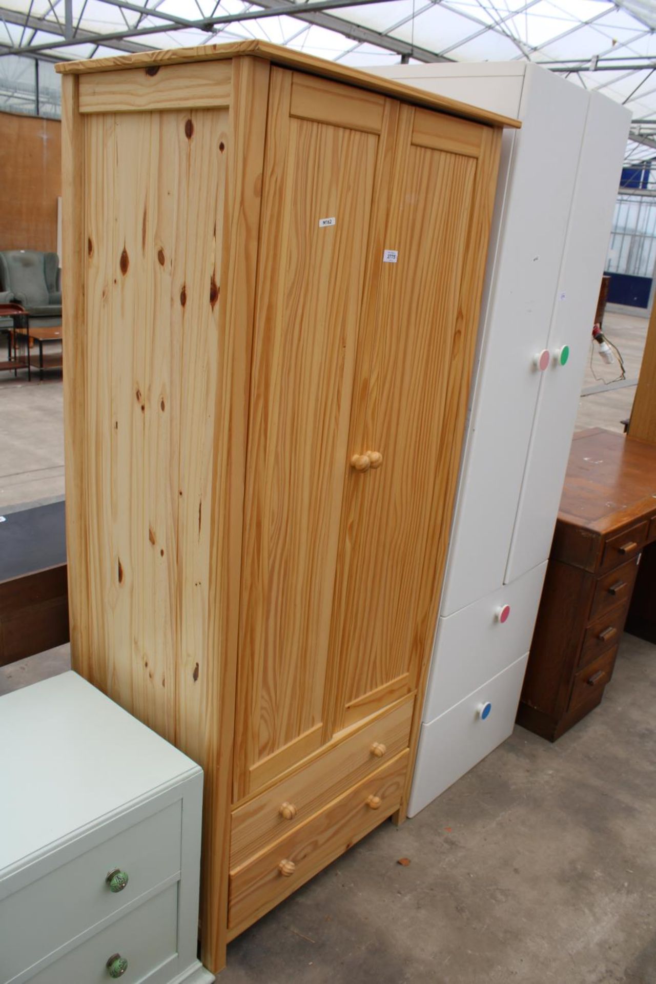 A MODERN PINE TWO DRAWER WARDROBE WITH TWO DRAWERS TO BASE, 30" WIDE