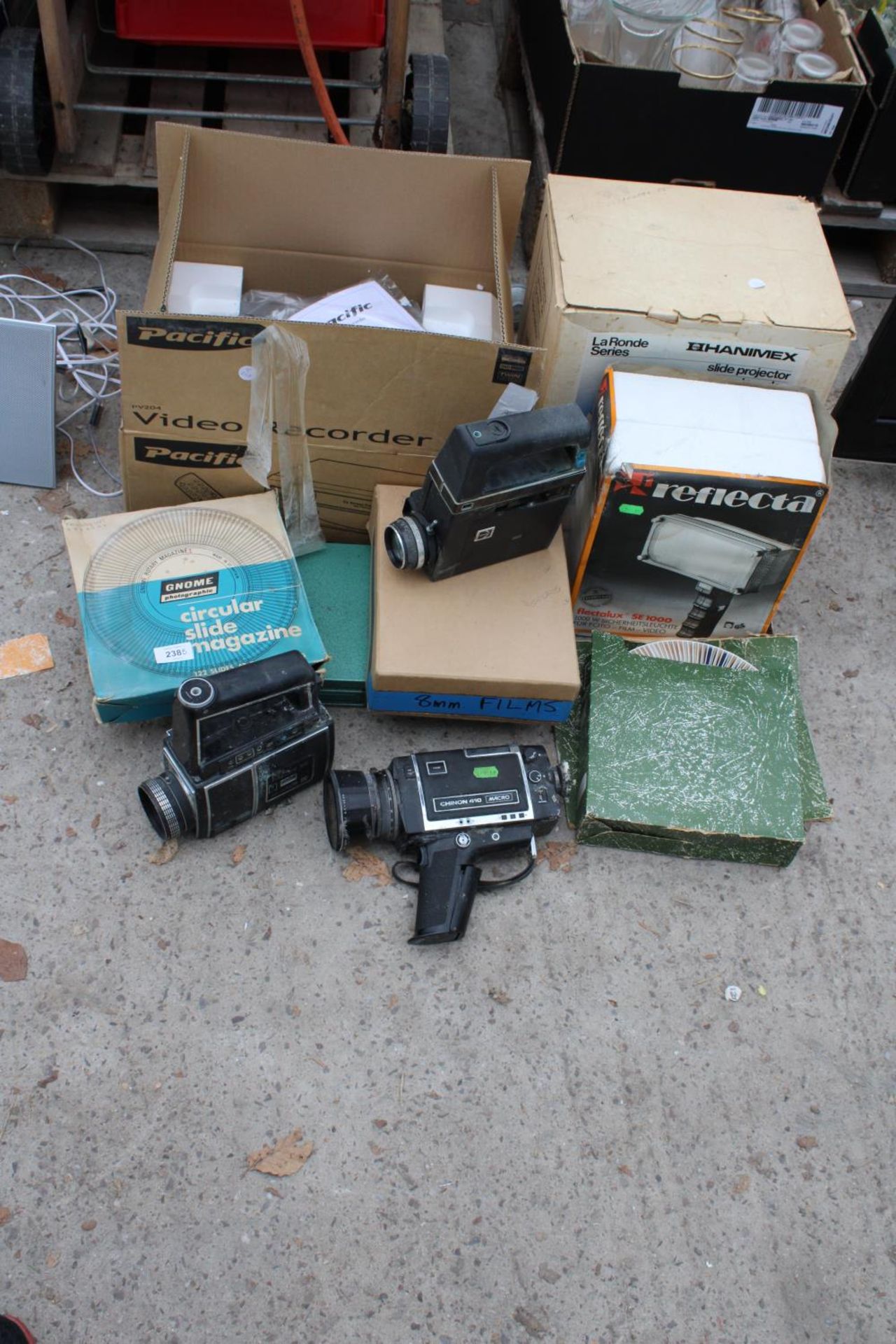 AN ASSORTMENT OF ITEMS TO INCLUDE CAMERAS, SLIDE PROJECTORS AND SLIDE MAGAZINES ETC