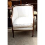 AN EDWARDIAN MAHOGANY AND INLAID UPHOLSTERED LOUNGE CHAIR