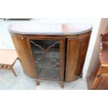 A MID 20TH CENTURY MAHOGANY BOW END DISPLAY CABINET ON BALL AND CLAW FEET, 48" WIDE