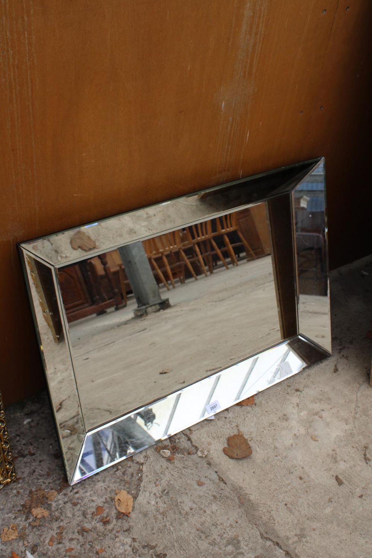 A MODERN BEVEL EDGE WALL MIRROR WITH SLOPING SIDE MIRRORS, 31" X 22"