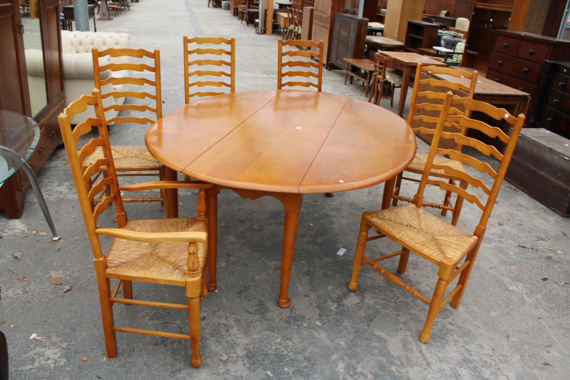 A GEORGIAN STYLE OVAL OAK WAKES TABLE, 77" X 59" OPENED AND SIX LADDER BACK DINING CHAIRS WITH - Image 3 of 9