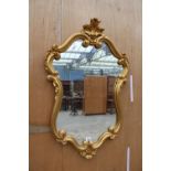 A 19TH CENTURY STYLE GOLD COLOURED WALL MIRROR, 39" X 25"