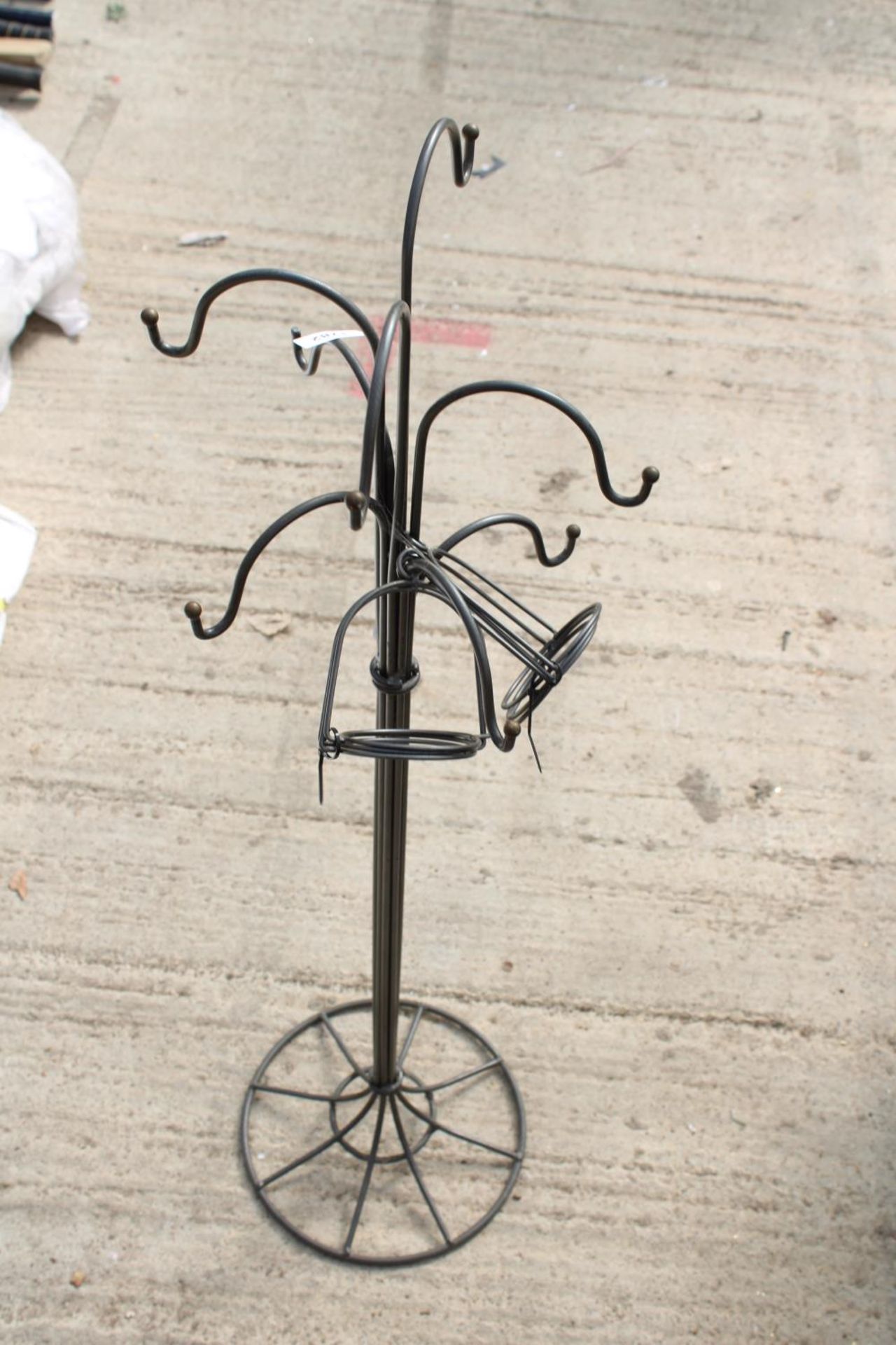 A DECORATIVE METAL HAT STAND