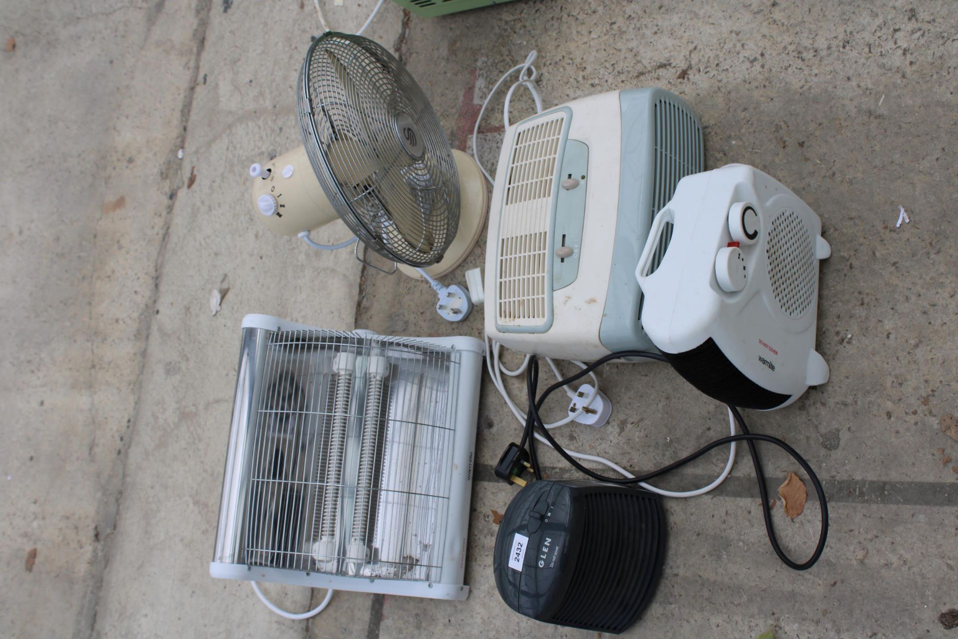 AN ASSORTMENT OF HEATERS AND A DESK FAN