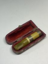 A SILVER AND BUTTERSCOTCH AMBER CHEROOT HOLDER