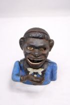 A VINTAGE CAST IRON AFRICAN AMERICAN MECHANICAL BANK