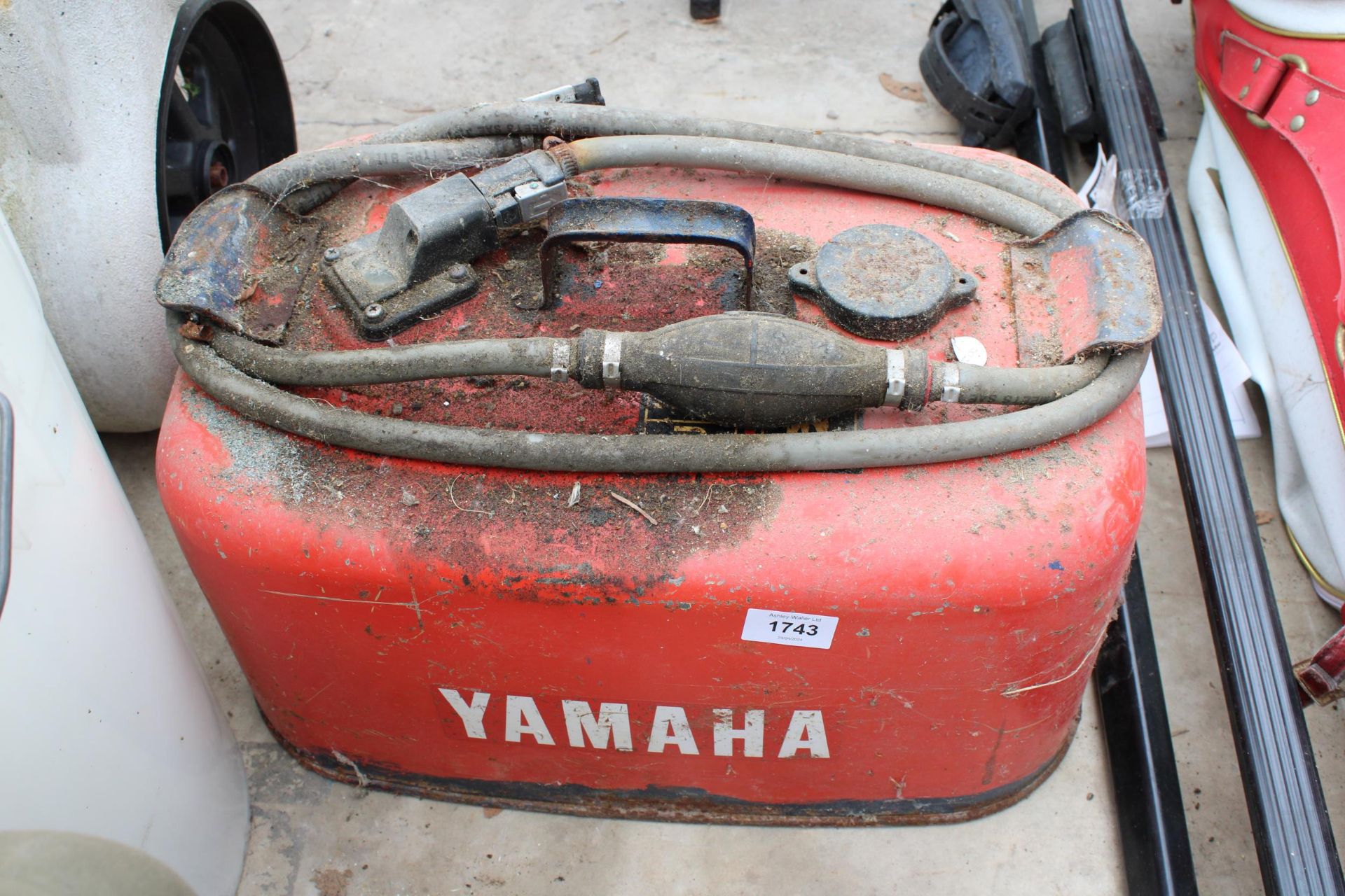 A VINTAGE AMAHA FUEL CAN WITH MANUAL PUMP