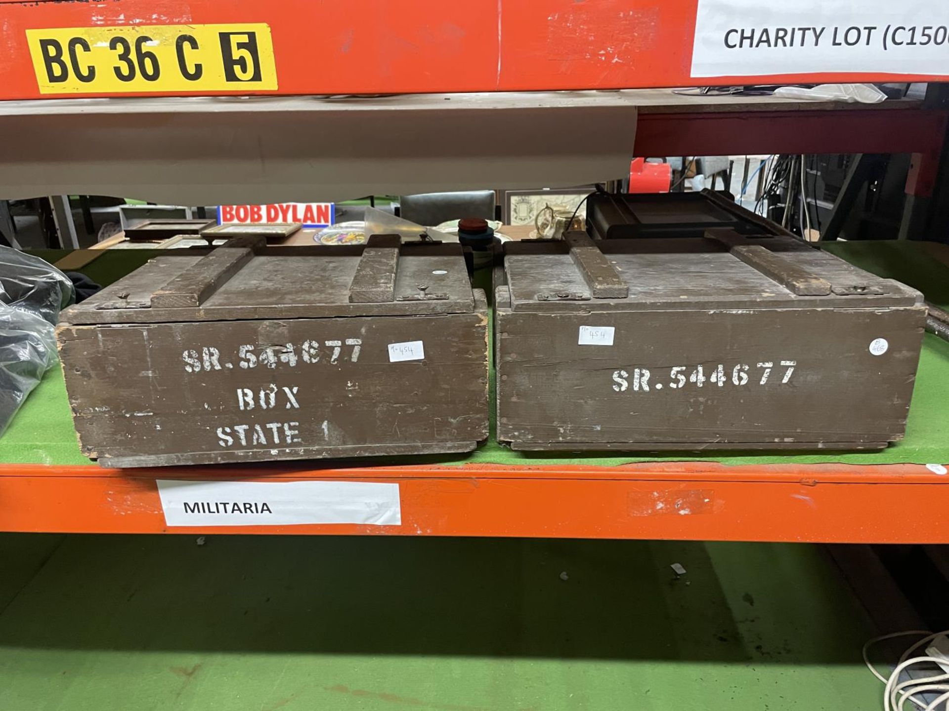 TWO GREEN PAINTED AMMUNITION BOXES MARKED SR 544677, AND A 1950 MILITARY ENAMEL PLATE (3)