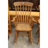 A VICTORIAN STYLE BEECH ROCKING CHAIR