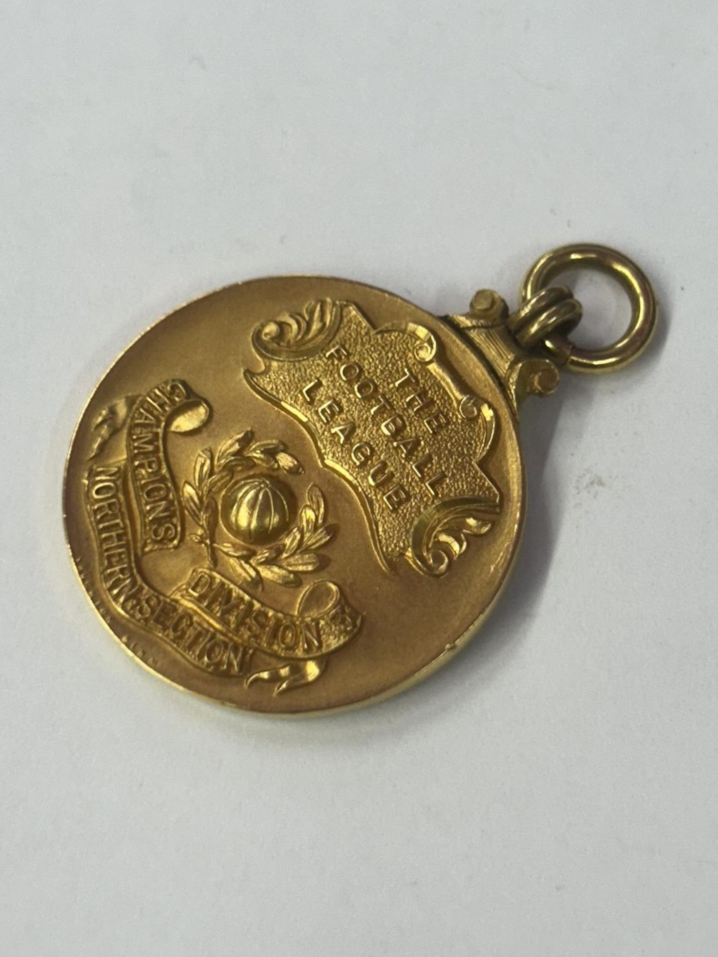 A HALLMARKED 9 CARAT GOLD FOOTBALL LEAGUE DIVISION 3 NORTHERN SECTION LEAGUE WINNERS MEDAL 1953-1954 - Image 4 of 5