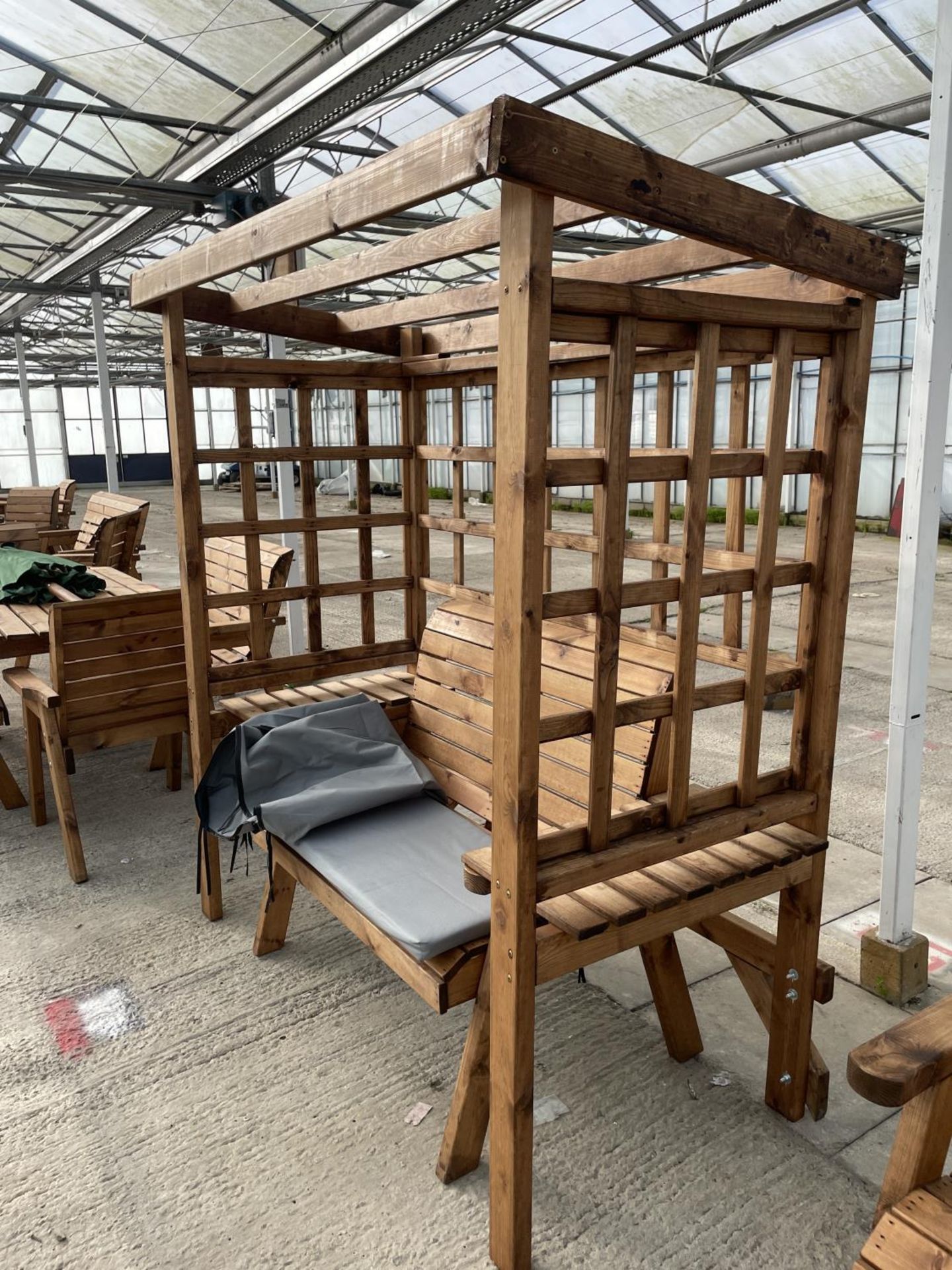 AN AS NEW EX DISPLAY CHARLES TAYLOR GARDEN FURNITURE ARBOUR WITH TWO