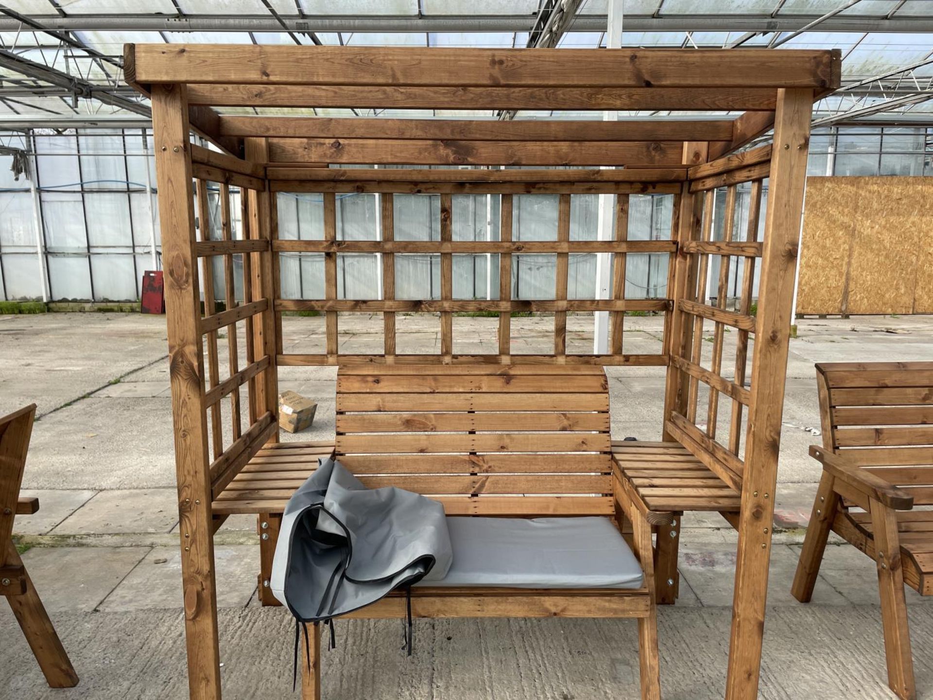 AN AS NEW EX DISPLAY CHARLES TAYLOR GARDEN FURNITURE ARBOUR WITH TWO