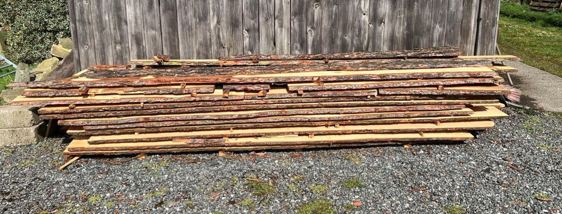 APPROX 20 LARCH CLADDING PLANKS APPROX 6' LONG LEFT OVER FROM A JOB THE PICTURES ARE OF THE