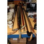 SEVEN VINTAGE WALKING STICKS, TWO WITH BRASS HORSES HEAD HANDLES, ONE WITH A BLACK LABRADOR