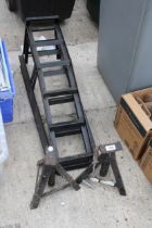 A PAIR OF METAL CAR RAMPS AND AXEL STANDS