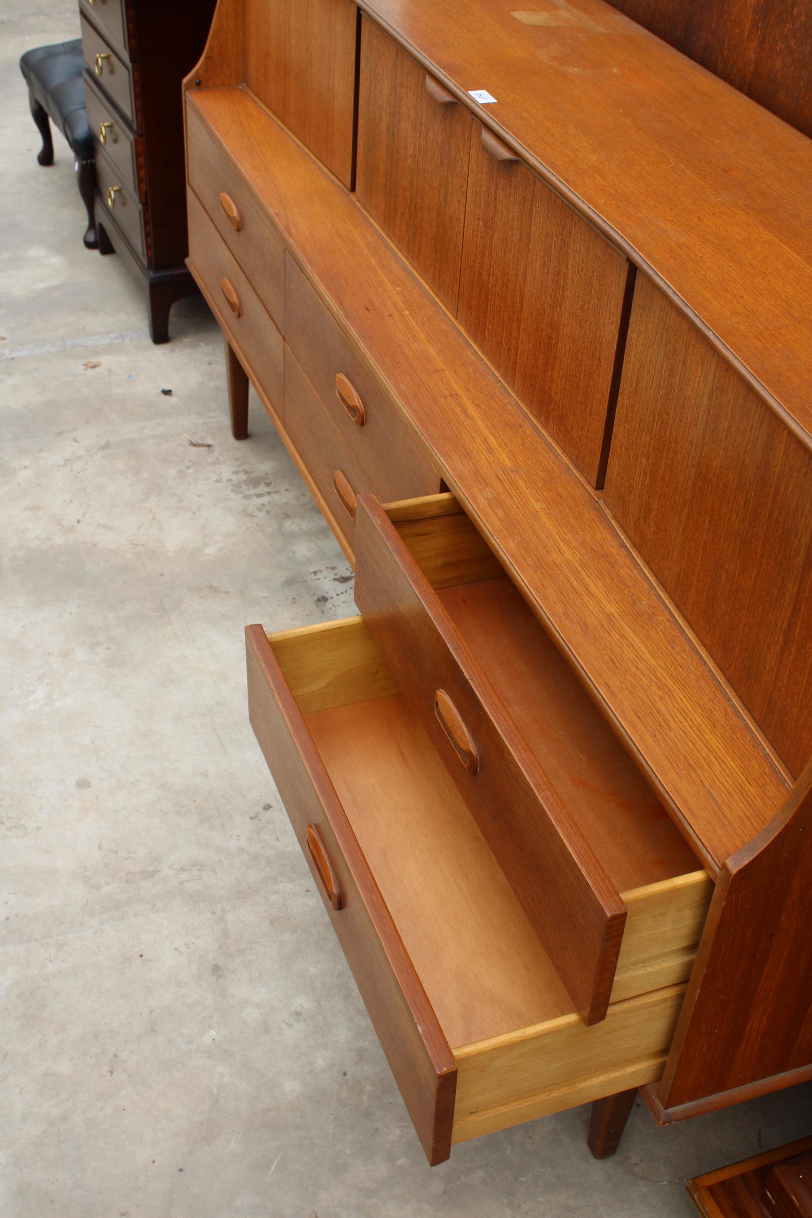 A RETRO TEAK PORTWOOD FURNITURE SIDEBOARD ENCLOSING SIX DRAWERS AND FOUR CUPBOARDS, 72" WIDE - Image 4 of 4