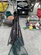 A LARGE ASSORTMENT OF FISHING RODS AND A LANDING NET
