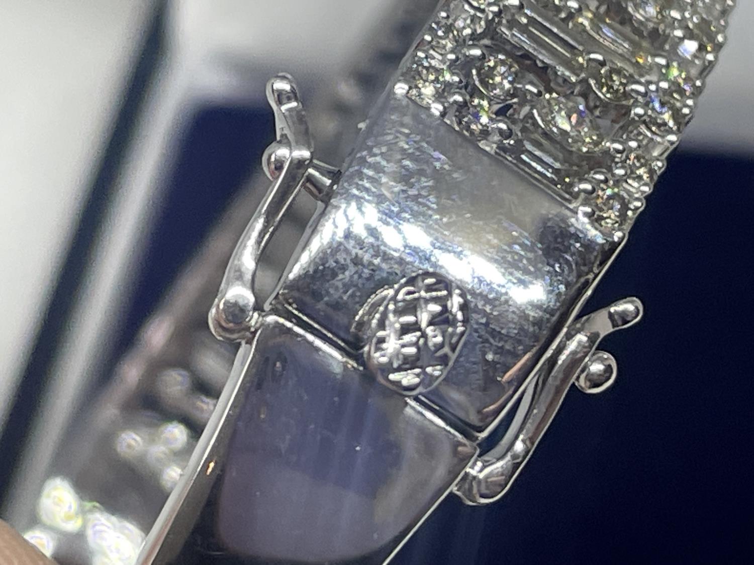 A NEW 9 CARAT WHITE GOLD HINGED BANGLE, SET WITH BRILLIANT AND BAGUETTE CUT DIAMONDS OF TOTAL WEIGHT - Image 3 of 5