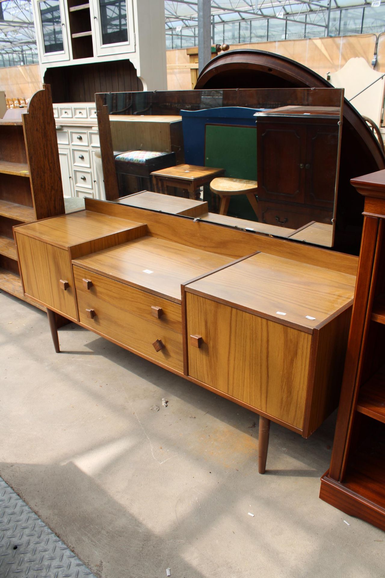 A RETRO TEAK LOW DRESSING TABLE ENCLOSING TWO DRAWERS AND TWO CUPBOARDS, 60" WIDE - Image 2 of 2