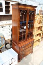 A MAHOGANY REPRODUX, BEVAN FUNNELL TWO DOOR BOOKCASE ON BASE WITH THREE DRAWERS AND SLIDE, 30"