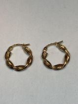 A PAIR OF 9 CARAT GOLD TWISTED HOOP EARRINGS GROSS WEIGHT 1.21 GRAMS