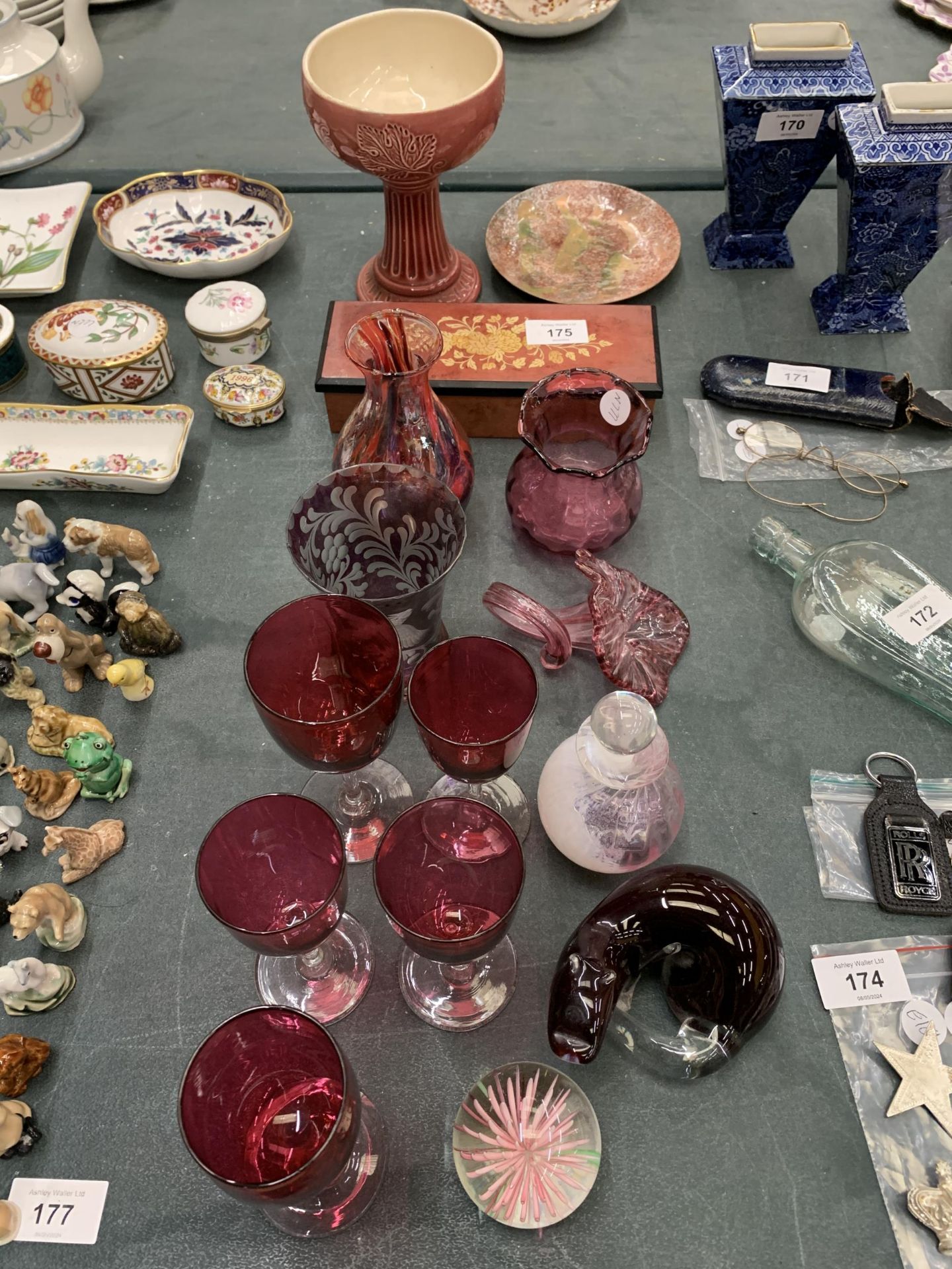 A COLLECTION OF CRANBERRY GLASSWARE TO INCLUDE GLASSES AND VASES, PLUS PAPERWEIGHTS, A PEN BOX,
