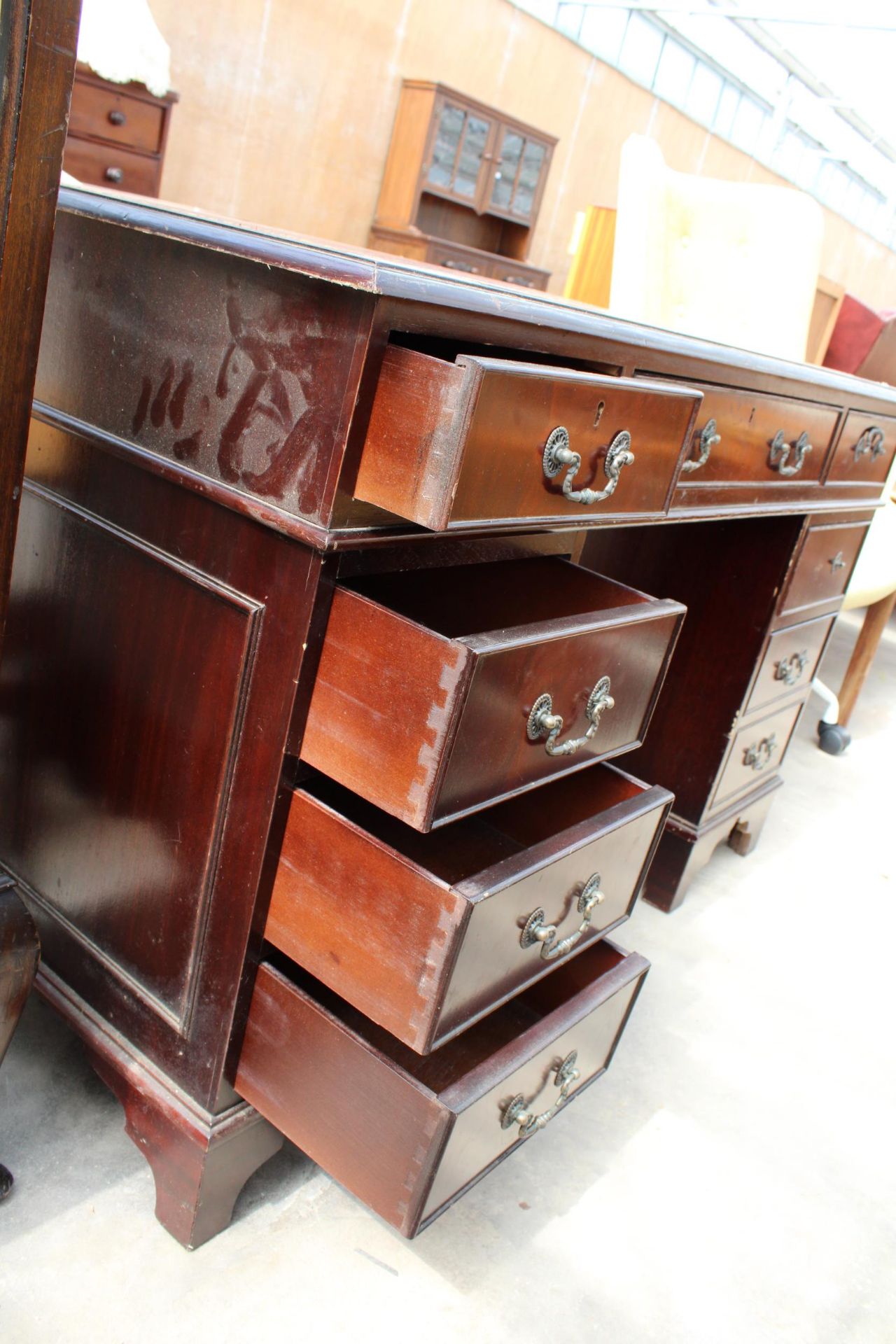 A MAHOGANY TWIN-PEDESTAL DESK ENCLOSING EIGHT DRAWERS AND INSET LEATHER TOP, 48" X 24" - Image 3 of 4