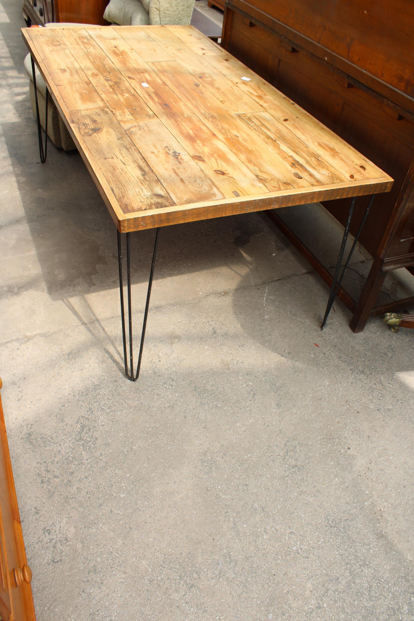 A RUSTIC PLANK TOP DINING TABLE ON HAIRPIN LEGS 72" X 37"