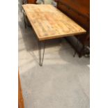 A RUSTIC PLANK TOP DINING TABLE ON HAIRPIN LEGS 72" X 37"