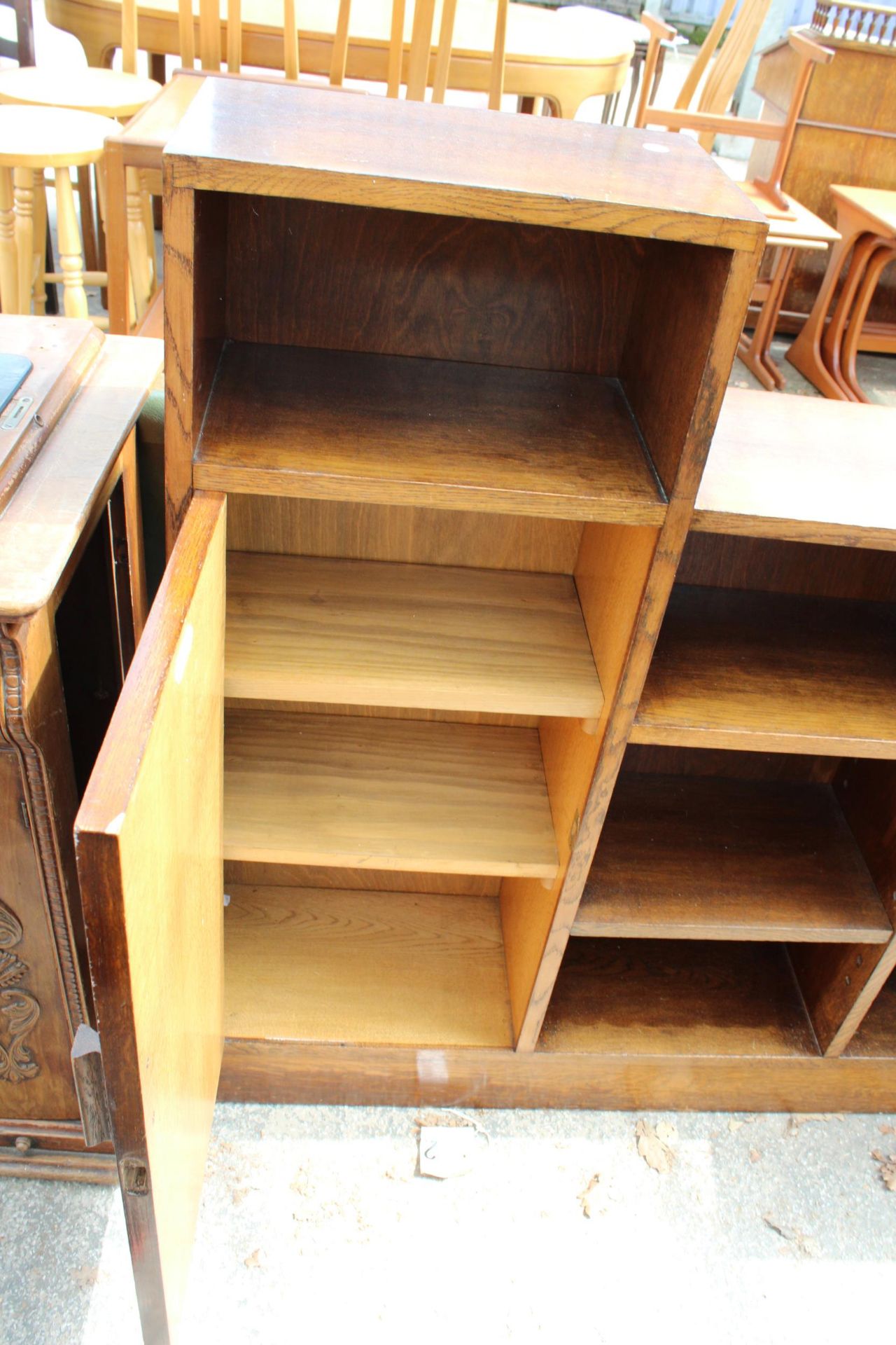 A MID 20TH CENTURY STEPPED OAK BOOKCASE WITH SINGLE CUPBOARD, 42" WIDE, BEARING JONES MOSS & CO, - Image 2 of 3