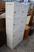 A MID 20TH CENTURY PAINTED STORAGE CABINET WITH EIGHT CUPBOARDS, 30" WIDE