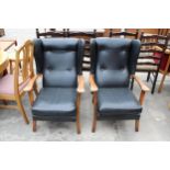 A PAIR OF MID 20TH CENTURY WINGED FIRESIDE CHAIRS