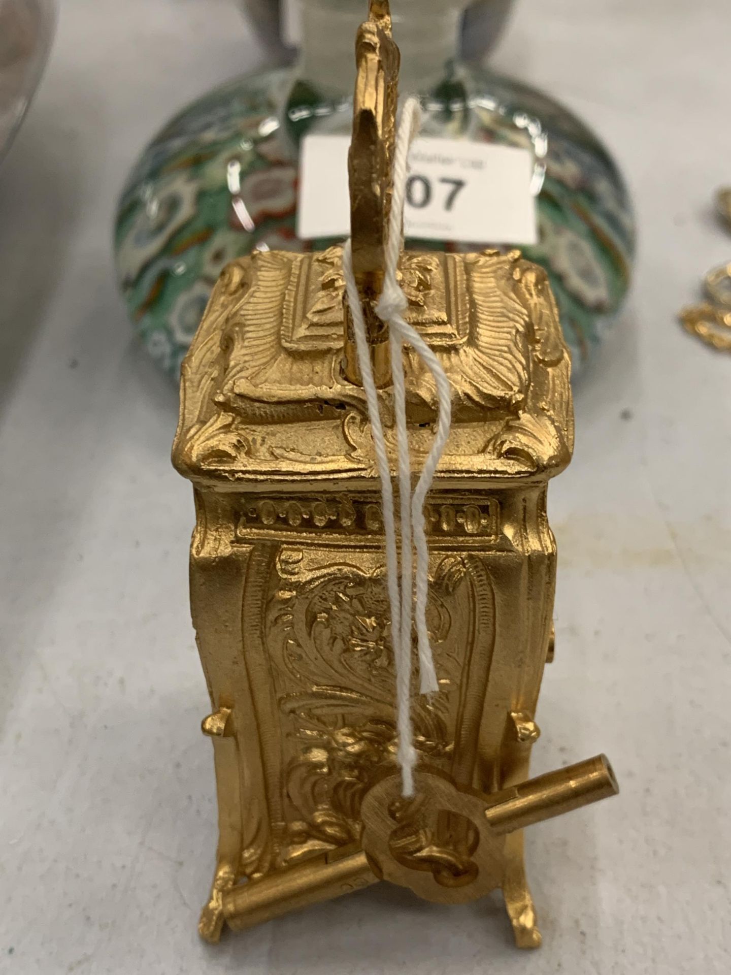 A MINIATURE GILDED FRENCH CLOCK WITH KEY HEIGHT 3.5" SEEN WORKING BUT NO WARRANTY - Image 2 of 3