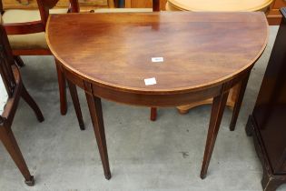 A 19TH CENTURY MAHOGANY AND CROSSBANDED DEMI-LUNE TABLE ON TAPERING LEGS WITH SPADE FEET , 36" WIDE
